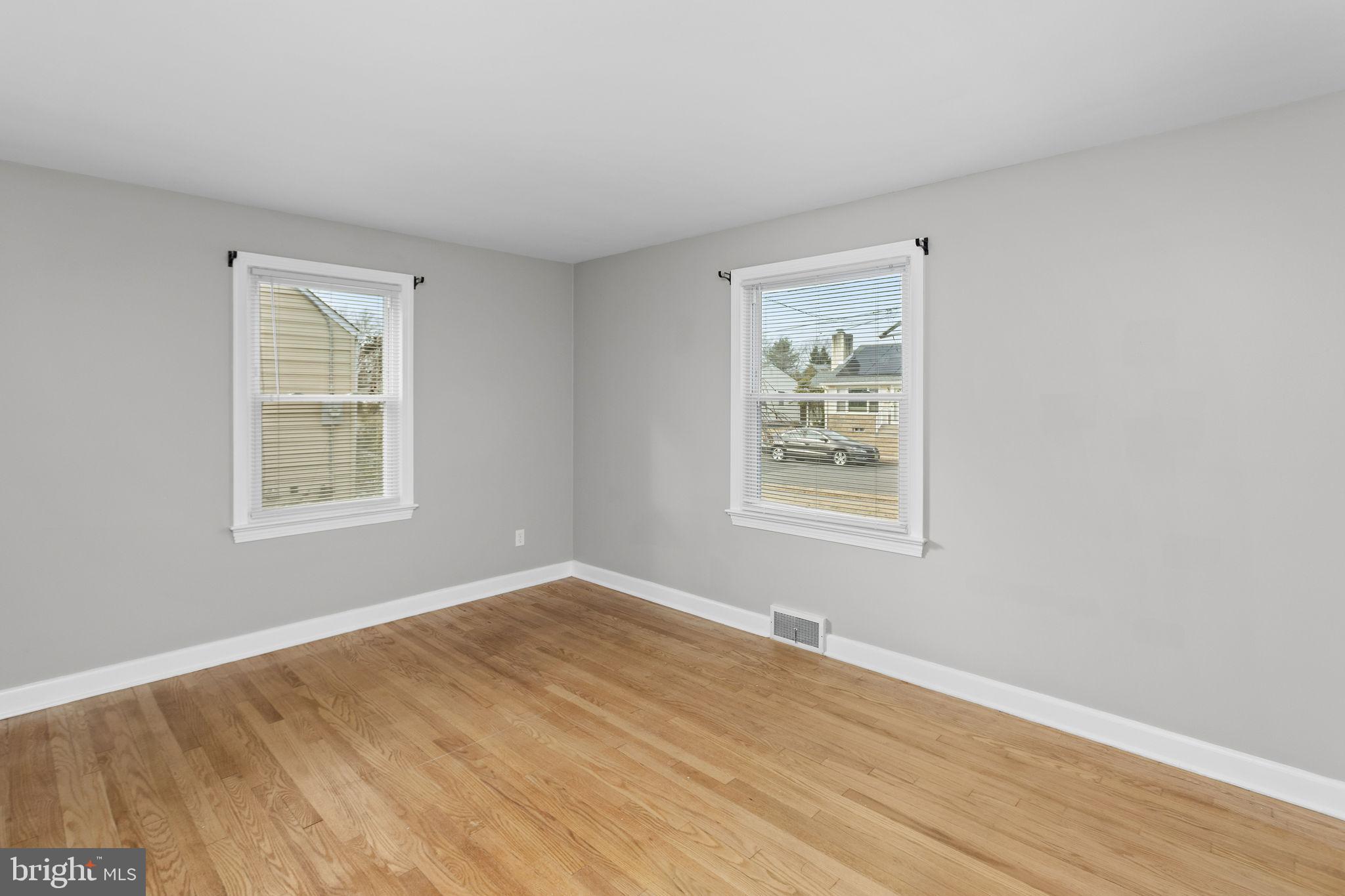 81 Wittenborn Avenue Hamilton, NJ 08619 - Photo 15 of 24 a view of an empty room with wooden floor and a window