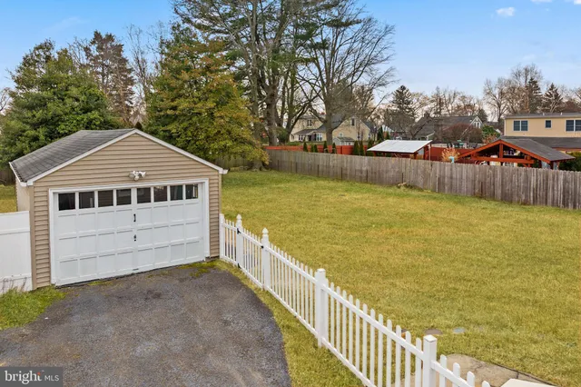 a view of a house with wooden floor and a yard