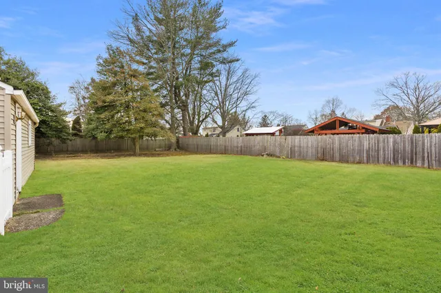 a view of a backyard with green space