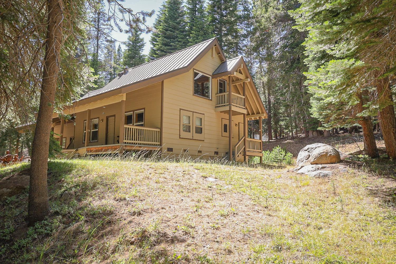 a view of a house with backyard of the house