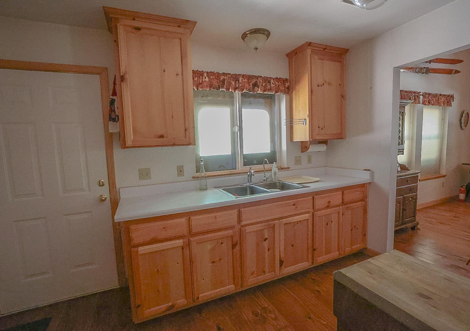 67922 Beasore Road Bass Lake, CA 93604 - Photo 13 of 39 a spacious bathroom with a granite countertop sink and a mirror
