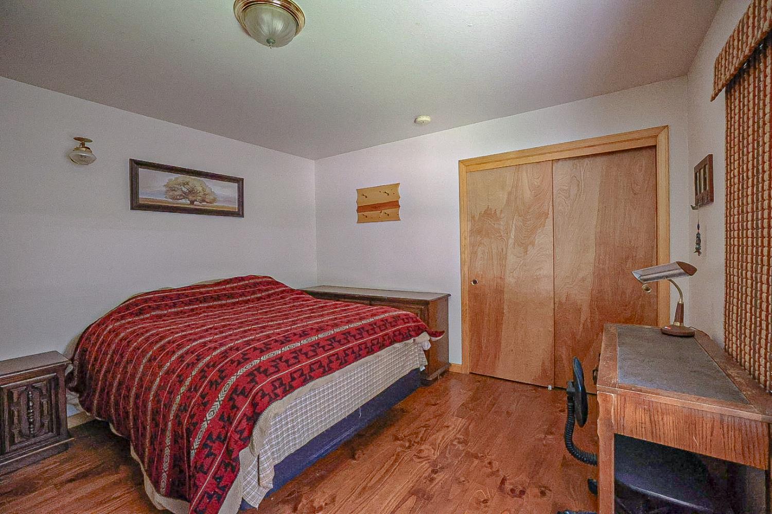 67922 Beasore Road Bass Lake, CA 93604 - Photo 20 of 39 a bedroom with a bed and dresser