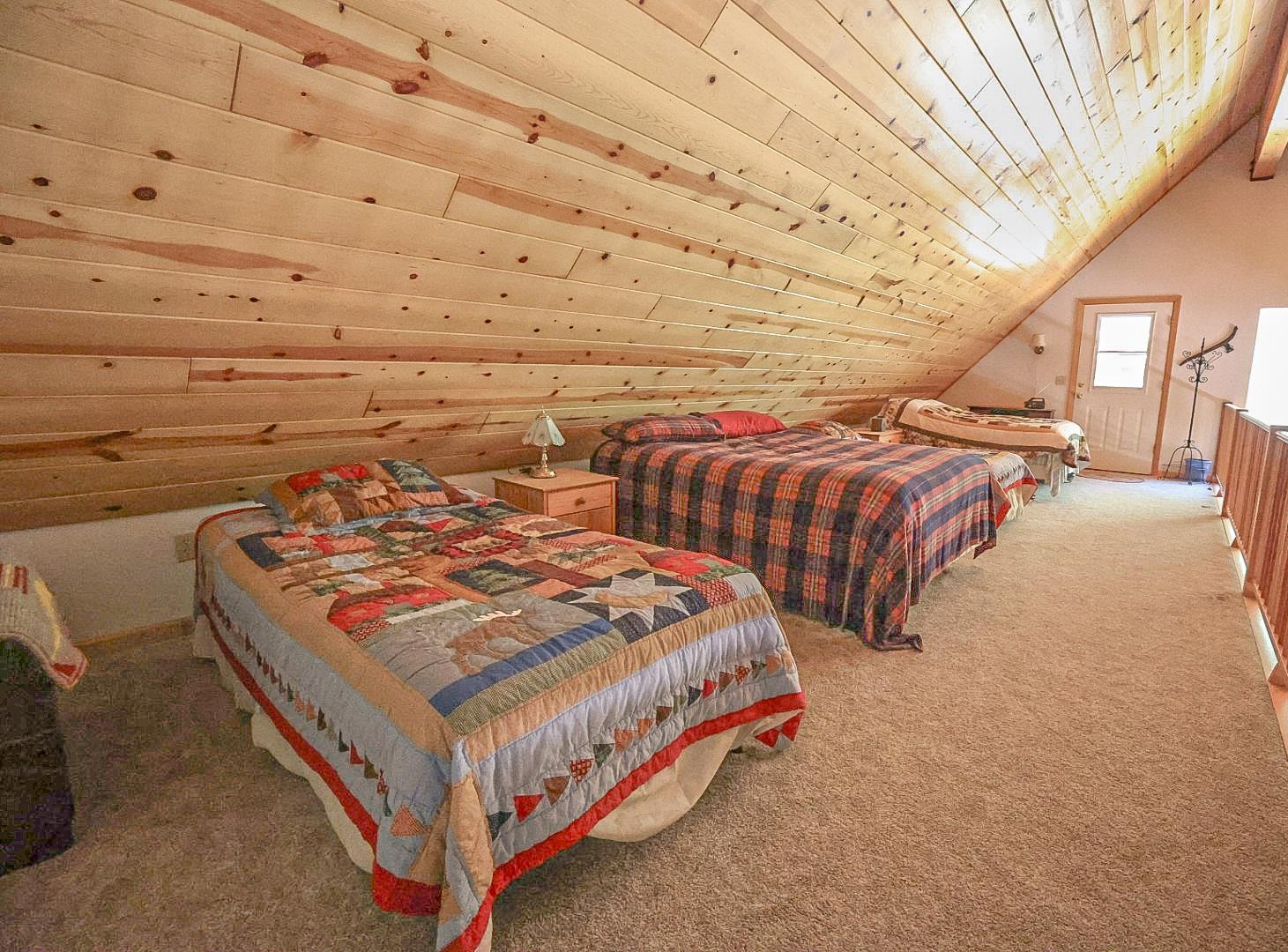 67922 Beasore Road Bass Lake, CA 93604 - Photo 23 of 39 a bed sitting in a bedroom next to a window