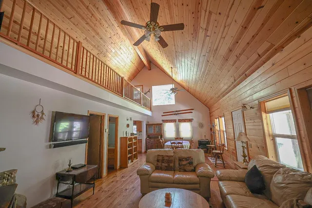 a dining room with furniture window and wooden floor