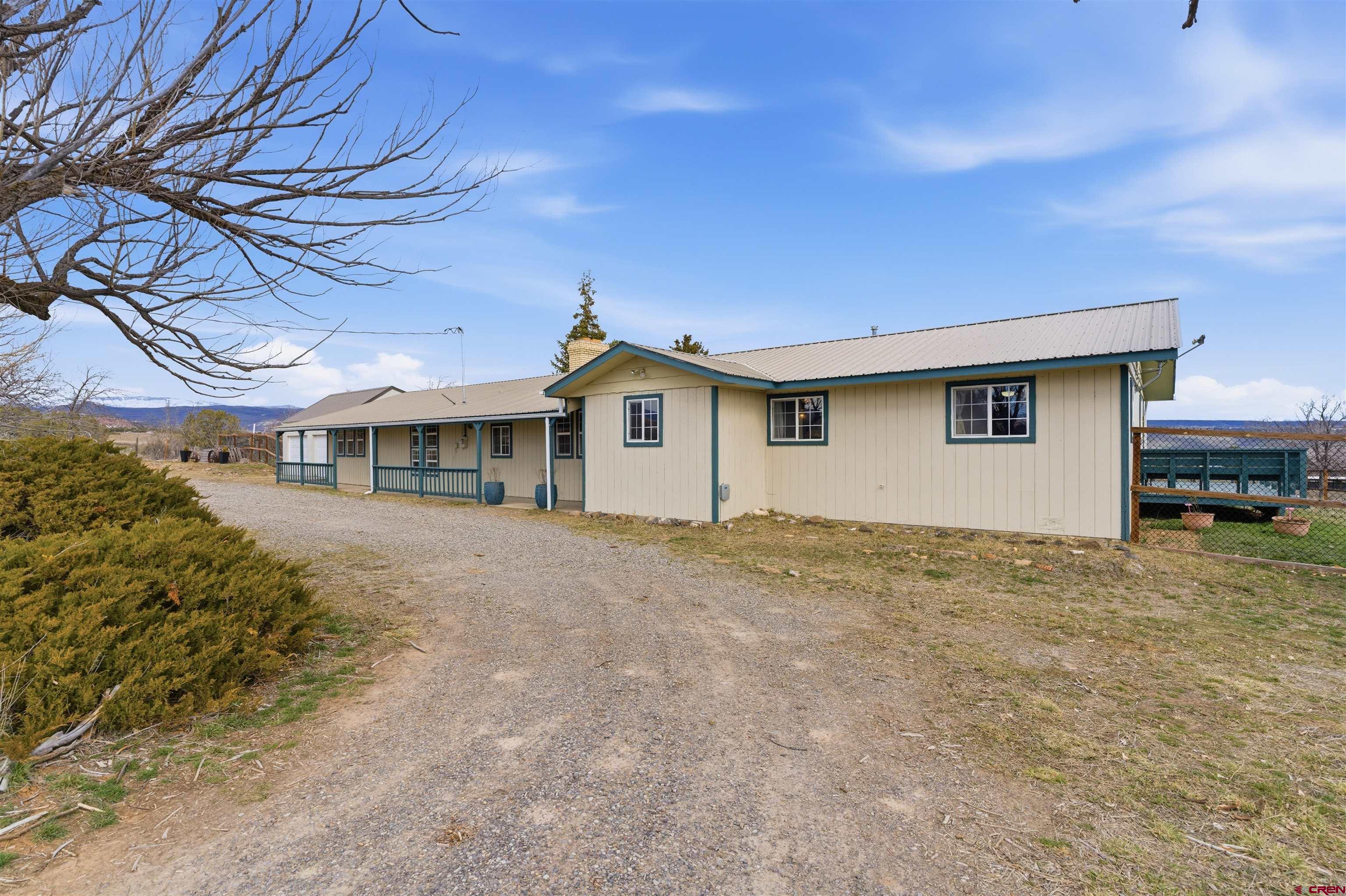 16216 2600th Road Cedaredge, CO 81413 - Photo 39 of 45 a front view of a house with a yard