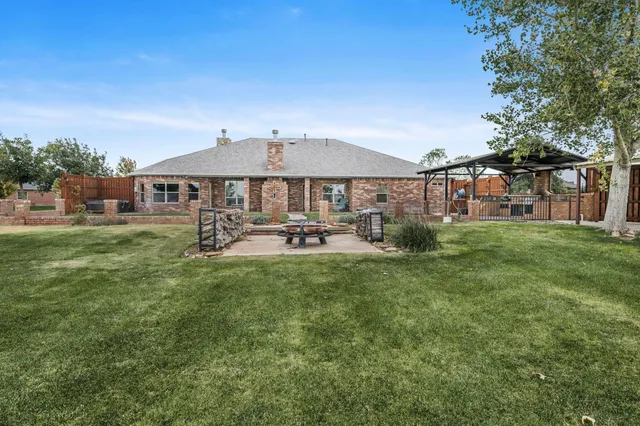 a living room with patio furniture and a fireplace