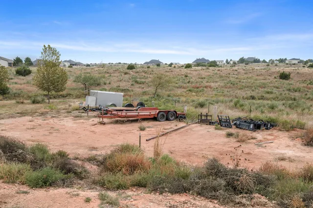 an aerial view of a houses with outdoor space