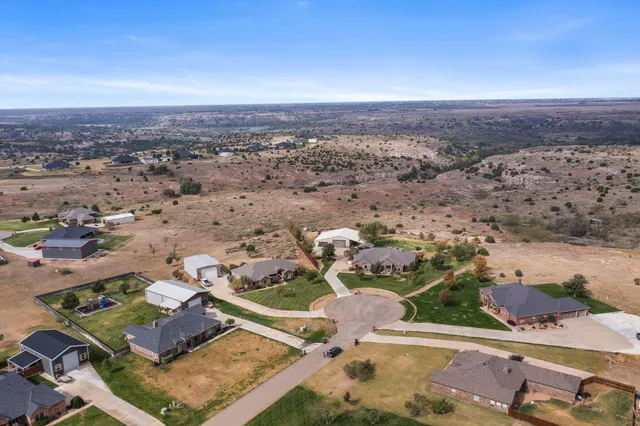 a view of a dining room with furniture and window