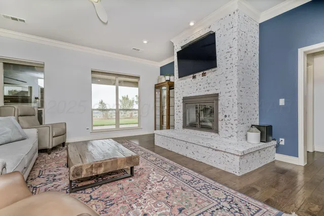 a spacious bedroom with a large bed a chandelier and closet