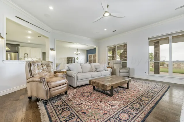 a spacious bathroom with a shower sink and mirror