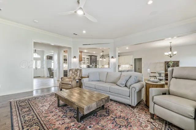 a bathroom with a granite countertop sink a mirror and a shower