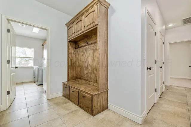 a bathroom with a double vanity sink mirror double and a bathtub