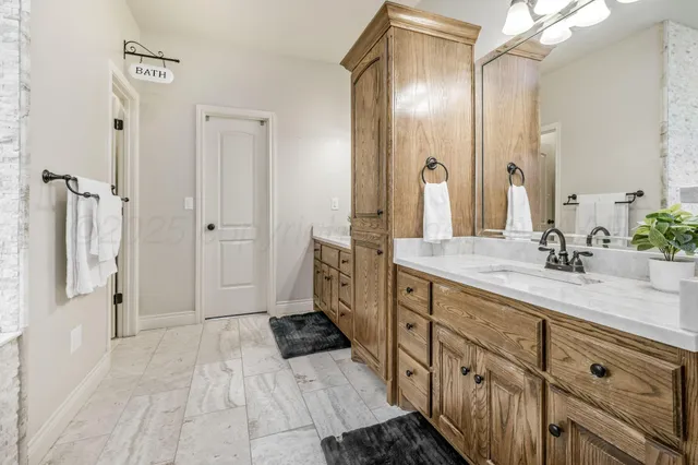 an aerial view of house with yard and mountain view in back