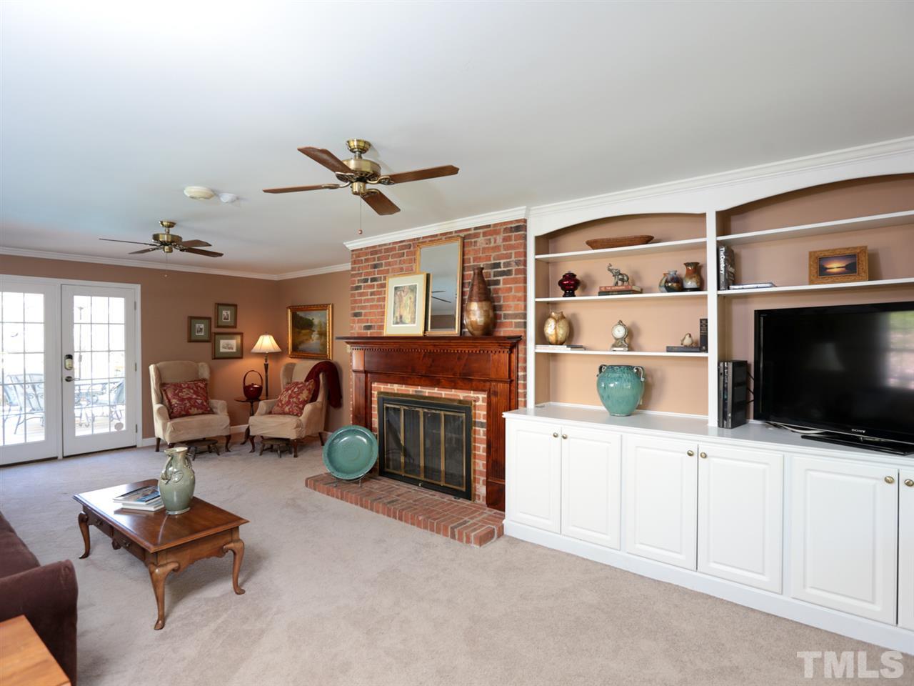 1413 Pony Run Road Raleigh, NC 27615 - Photo 11 of 25 a living room with furniture and a flat screen tv
