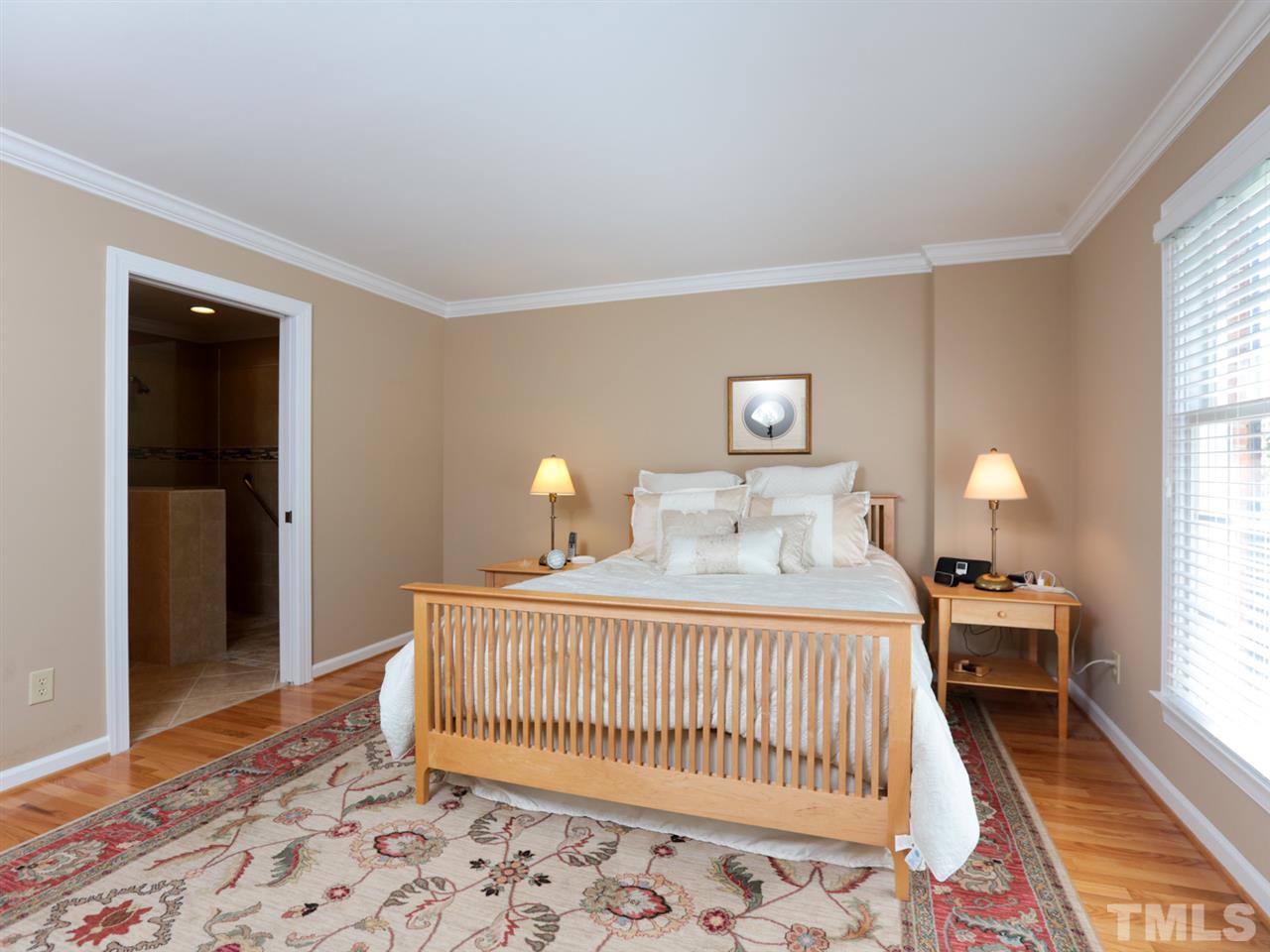 1413 Pony Run Road Raleigh, NC 27615 - Photo 12 of 25 a bedroom with a bed and a window