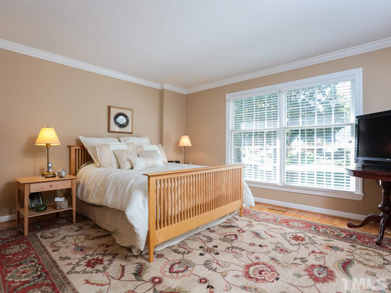 1413 Pony Run Road Raleigh, NC 27615 - Photo 13 of 25 a bedroom with a bed and a window with outer view