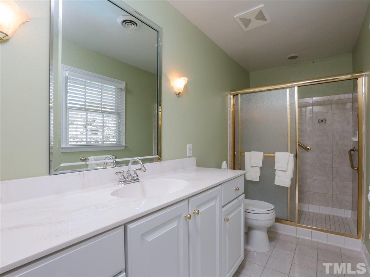 1413 Pony Run Road Raleigh, NC 27615 - Photo 19 of 25 a bathroom with a sink toilet and shower