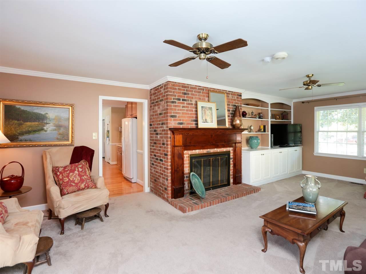 1413 Pony Run Road Raleigh, NC 27615 - Photo 10 of 25 a living room with furniture and a fireplace