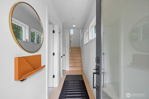 a view of a entryway with wooden floor