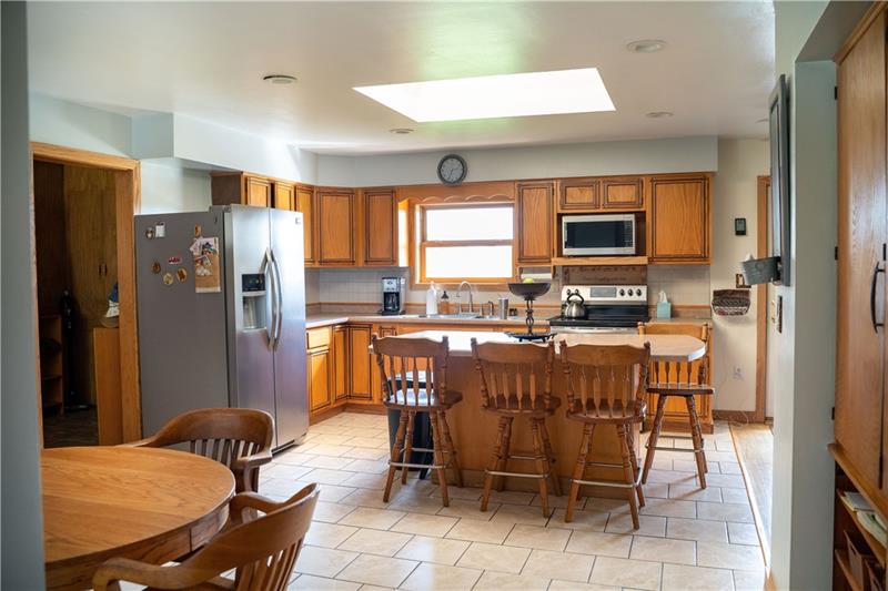 1276 Foster Road Volant, PA 16156 - Photo 12 of 24 Warm up in the adjoining dining area complete with wood stove.