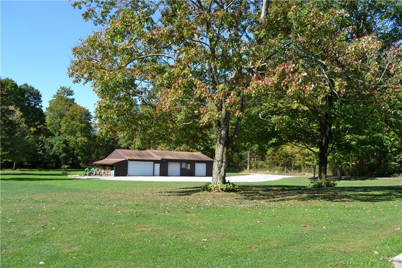1276 Foster Road Volant, PA 16156 - Photo 3 of 24 Car enthusiast? Love boating? This is the property for you!