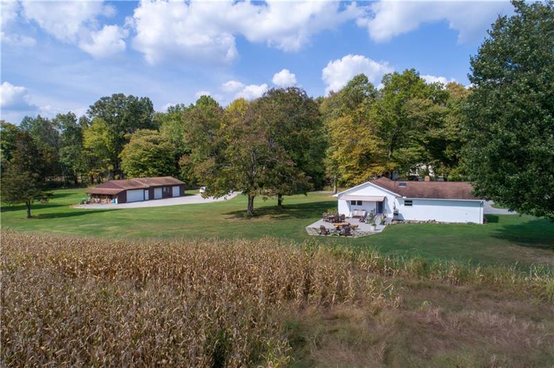 1276 Foster Road Volant, PA 16156 - Photo 7 of 24 Mature trees and perennials complement the landscape.