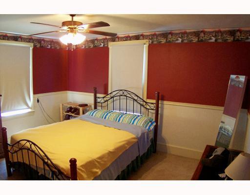 1440 Ridge Avenue Coraopolis, PA 15108 - Photo 4 of 8 Master Bedroom. LARGE MASTER BEDROOM TASTEFULLY DECORATED WITH CHAIR RAIL, LIGHTED CEILING FAN TWO LARGE WINDOWS FOR PLENTY OF NATURAL LIGHT