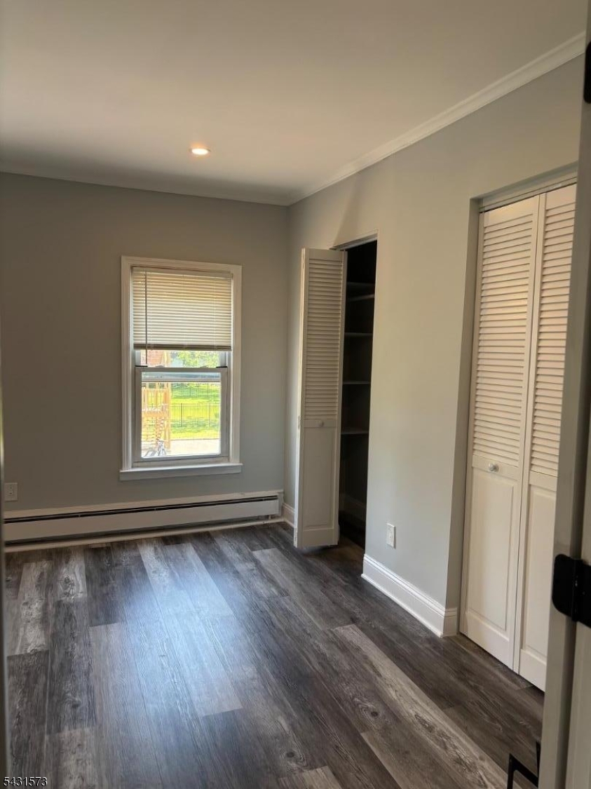 358 Woodland Road, Unit 2 Madison, NJ 07940 - Photo 25 of 50 an empty room with wooden floor and windows