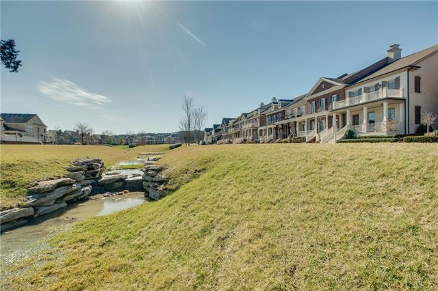 1367 Eliot Road Franklin, TN 37064 - Photo 2 of 30 a view of a lake with houses in the background