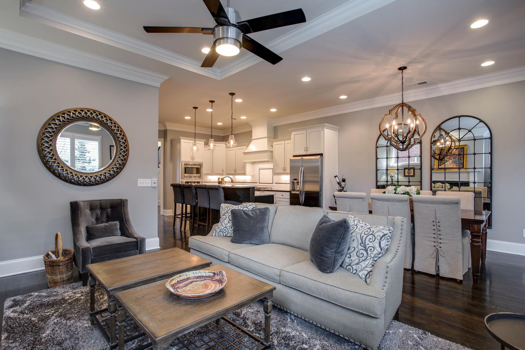 1367 Eliot Road Franklin, TN 37064 - Photo 11 of 30 a living room with furniture a mirror and a chandelier