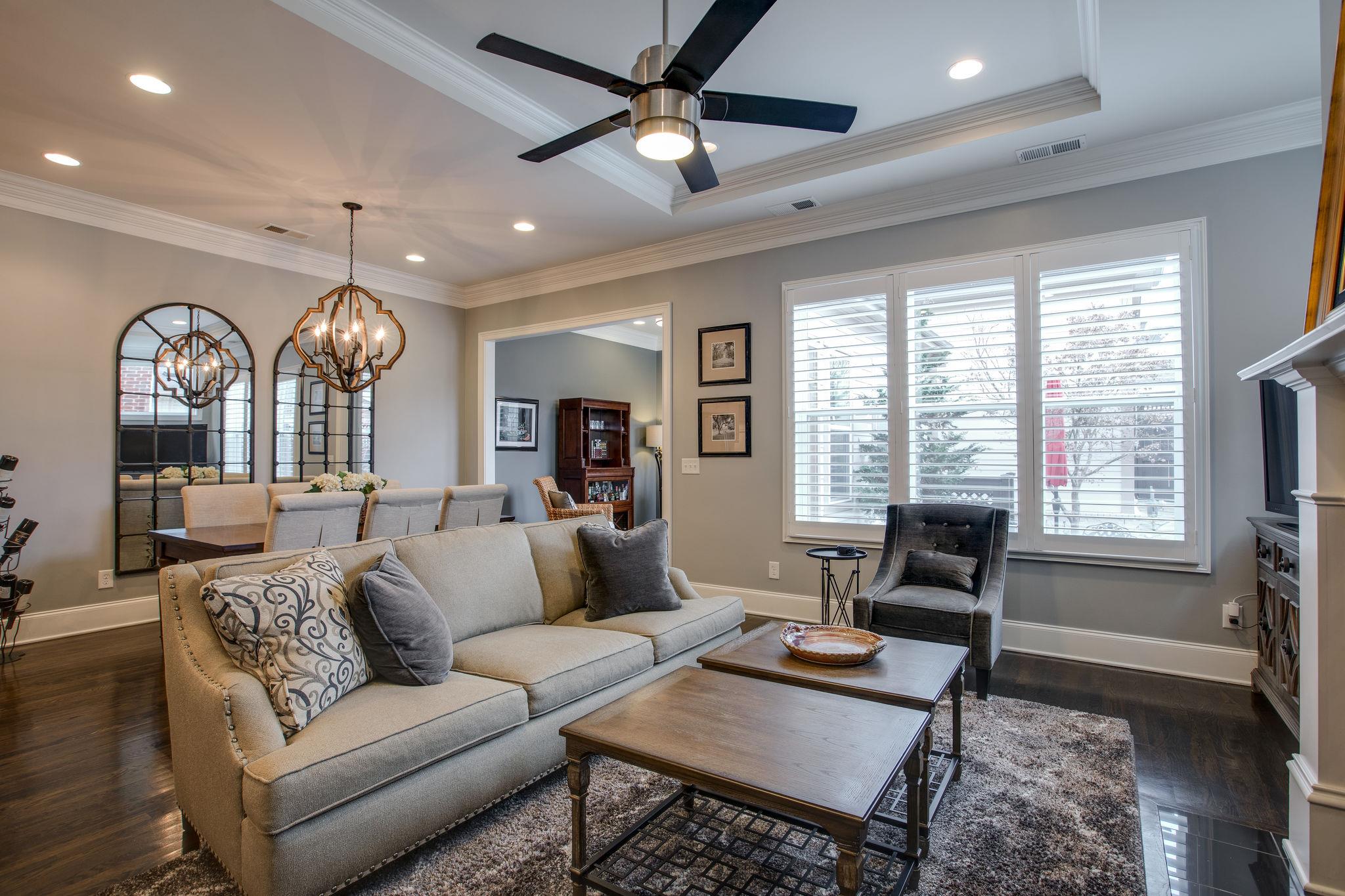 1367 Eliot Road Franklin, TN 37064 - Photo 12 of 30 a living room with furniture a chandelier and a large window