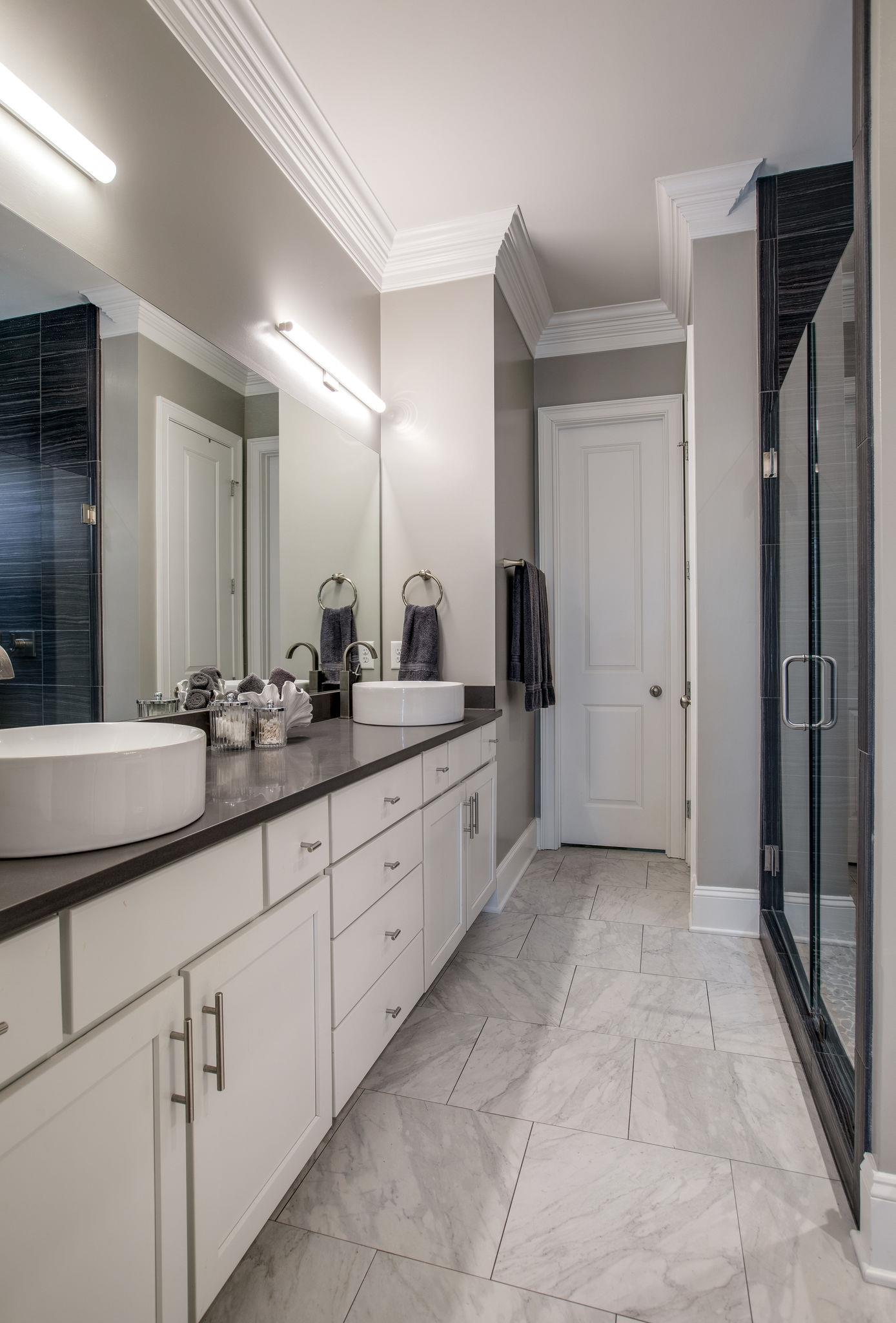 1367 Eliot Road Franklin, TN 37064 - Photo 18 of 30 a spacious bathroom with a double vanity sink a mirror and a shower