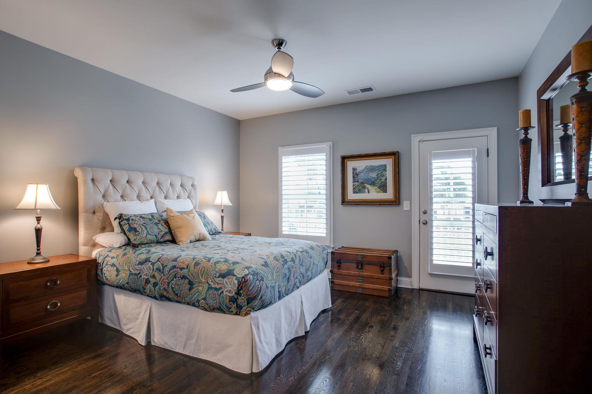 1367 Eliot Road Franklin, TN 37064 - Photo 24 of 30 a bedroom with a bed and wooden floor