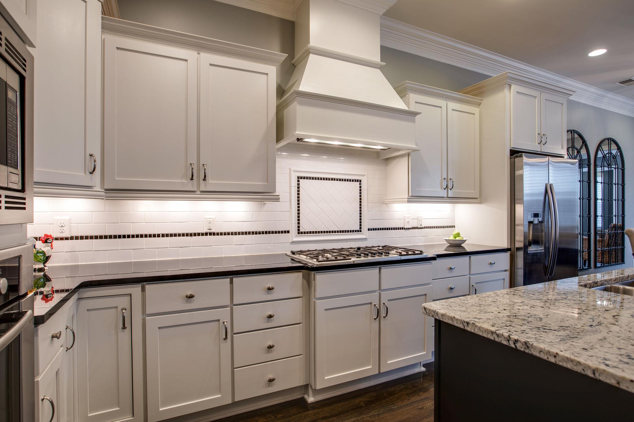 1367 Eliot Road Franklin, TN 37064 - Photo 4 of 30 a kitchen with granite countertop a sink stainless steel appliances and cabinets