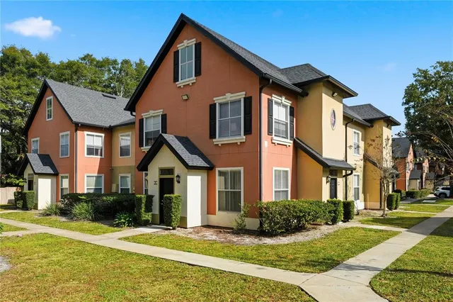 a view of a house with a yard