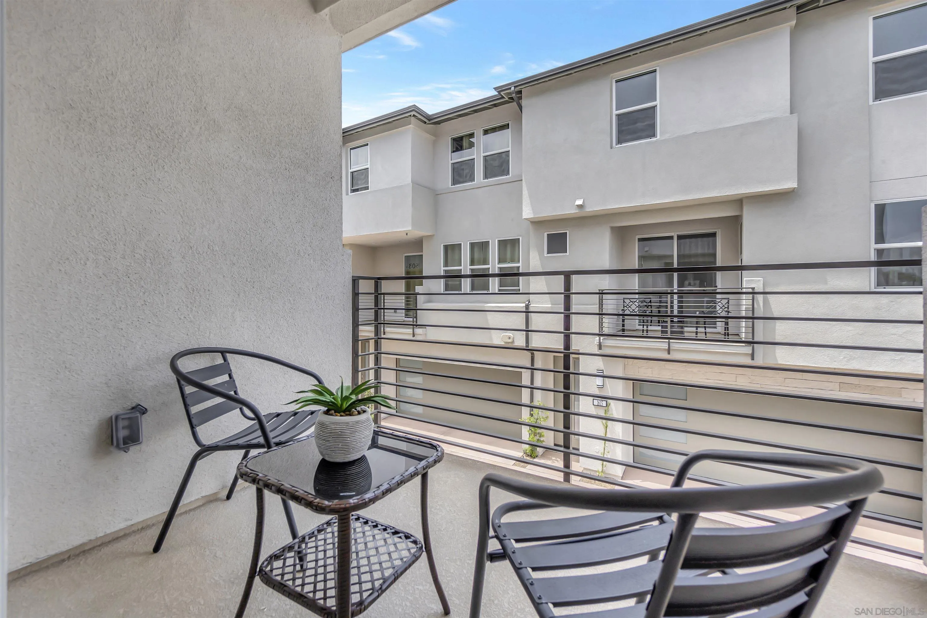 1531 West Bushell Street Anaheim, CA 92805 - Photo 11 of 27 a view of a balcony with table and chairs