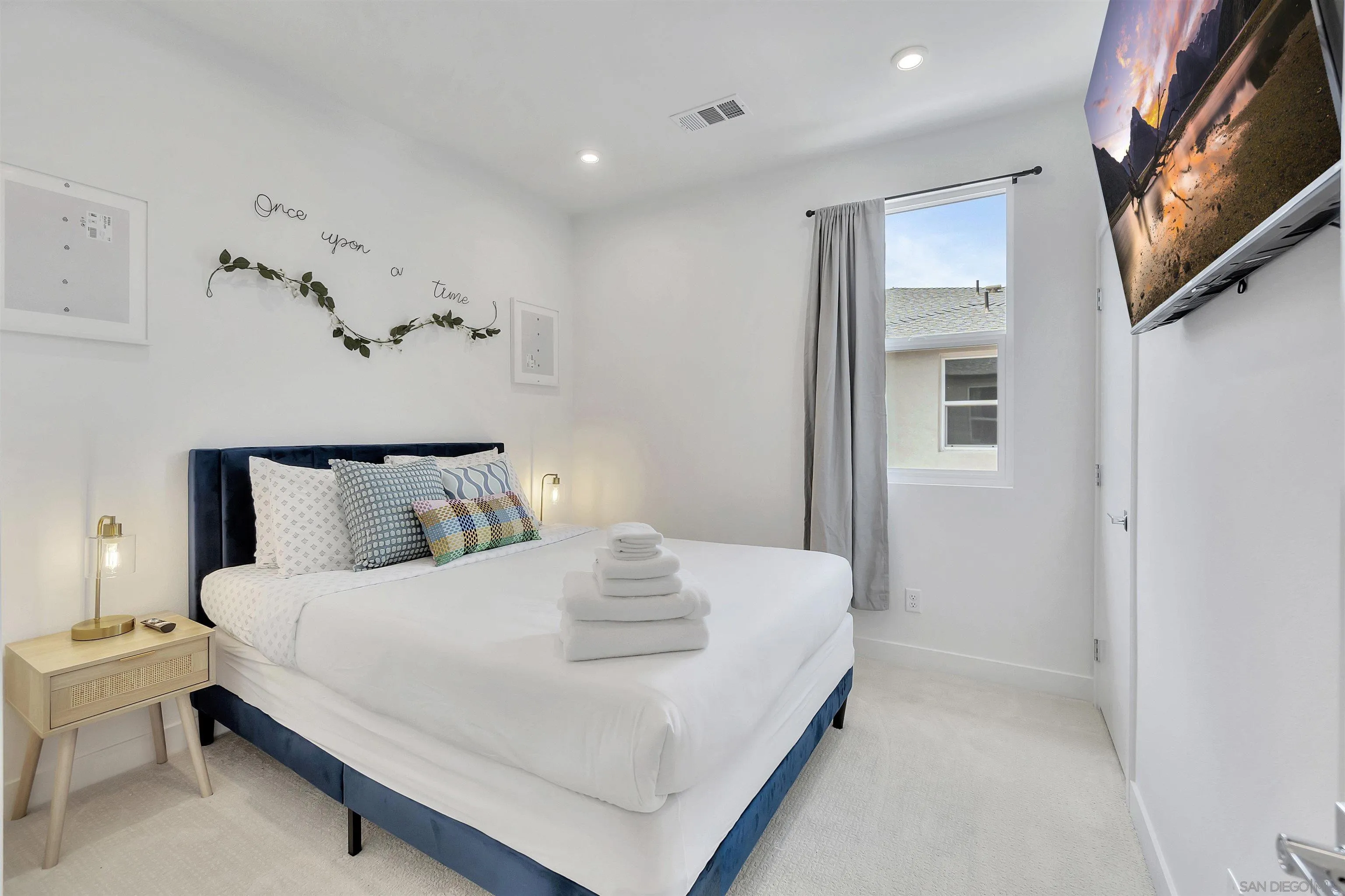 1531 West Bushell Street Anaheim, CA 92805 - Photo 14 of 27 a bedroom with a bed and a night stand