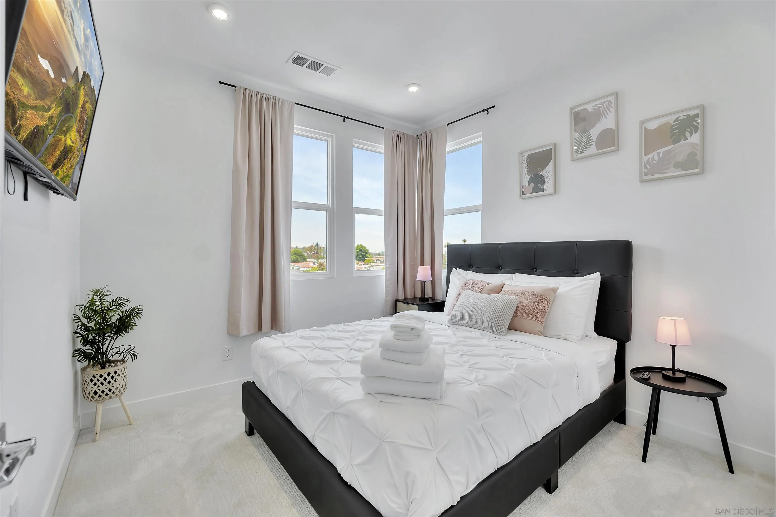 1531 West Bushell Street Anaheim, CA 92805 - Photo 16 of 27 a bedroom with a bed and a potted plant