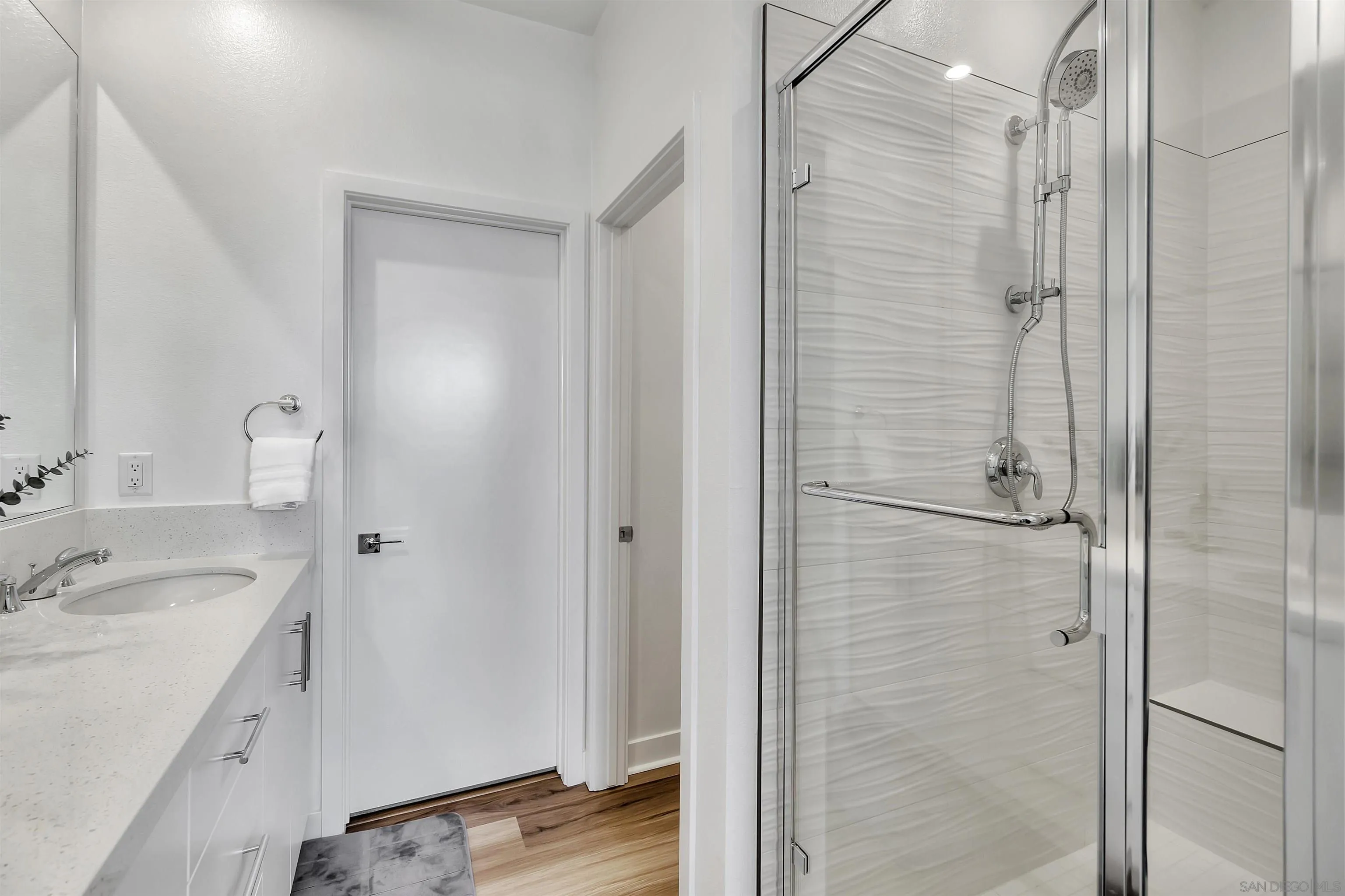 1531 West Bushell Street Anaheim, CA 92805 - Photo 20 of 27 a bathroom with a sink a mirror and shower