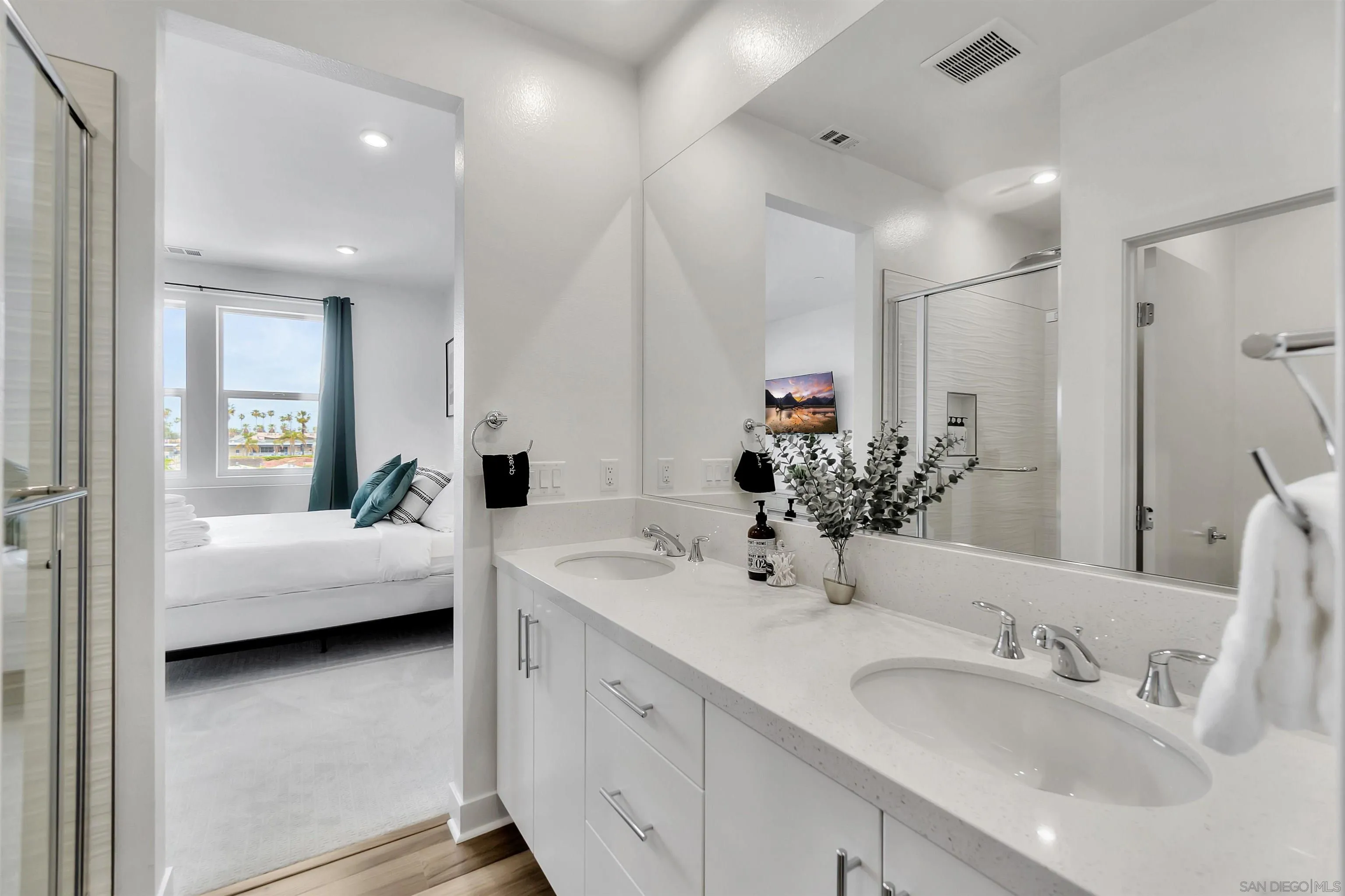 1531 West Bushell Street Anaheim, CA 92805 - Photo 22 of 27 a en suite bathroom with a double vanity sink and mirror