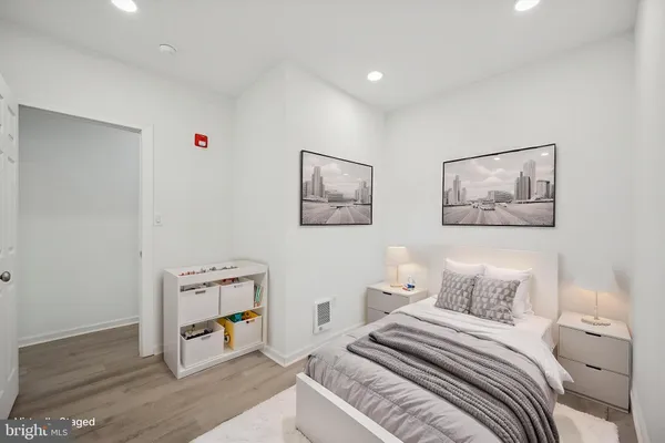 a bedroom with a bed and a cabinets