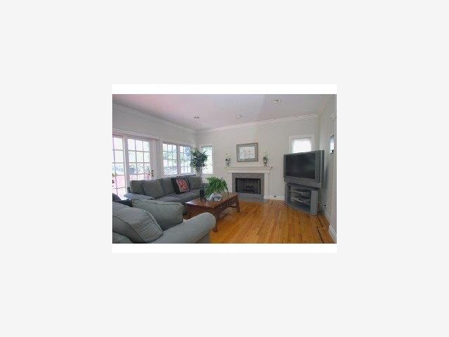 177 Warren Road San Mateo, CA 94401 - Photo 2 of 9 a living room with furniture and a fireplace