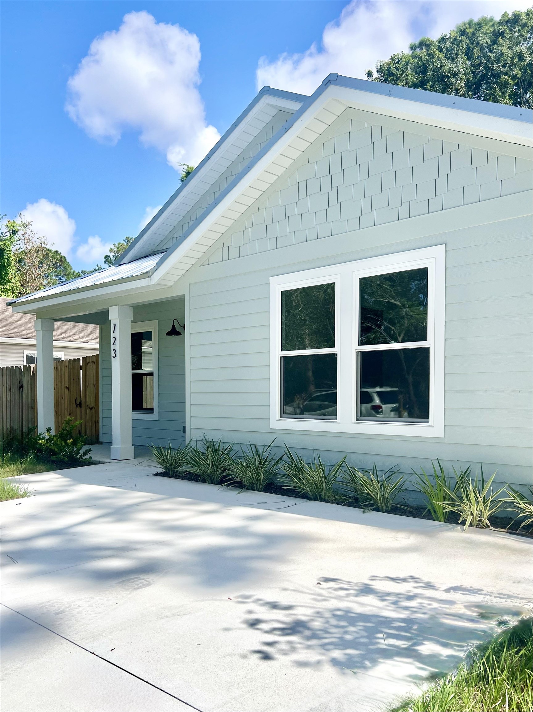 723 West 6th Street St. Augustine, FL 32084 - Photo 3 of 14 a front view of a house with a yard