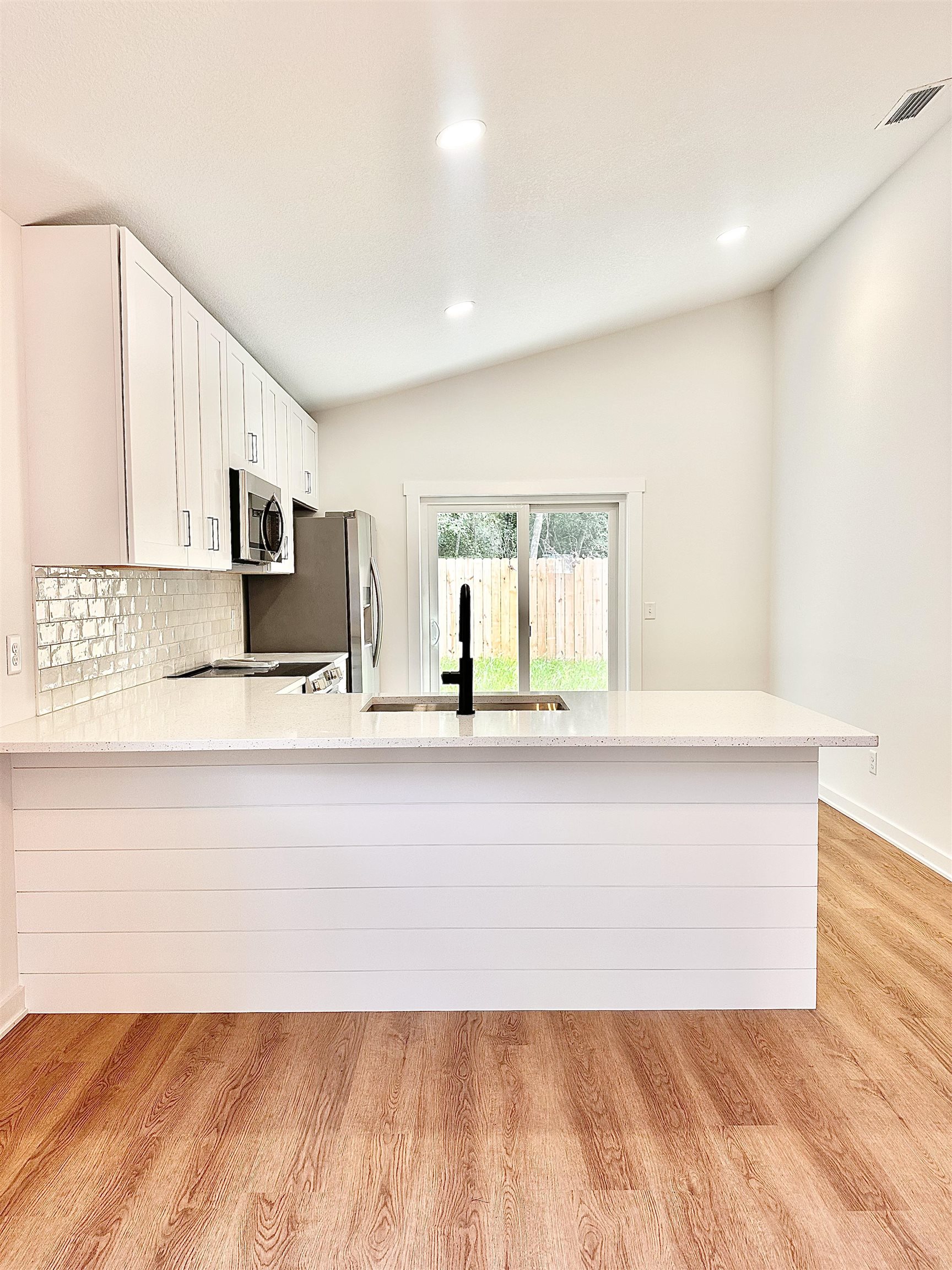 723 West 6th Street St. Augustine, FL 32084 - Photo 5 of 14 a bathroom with a sink and a mirror