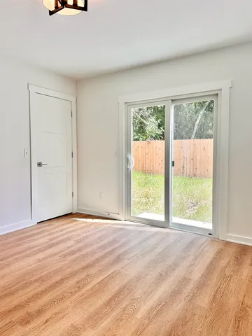 a view of an empty room with a window