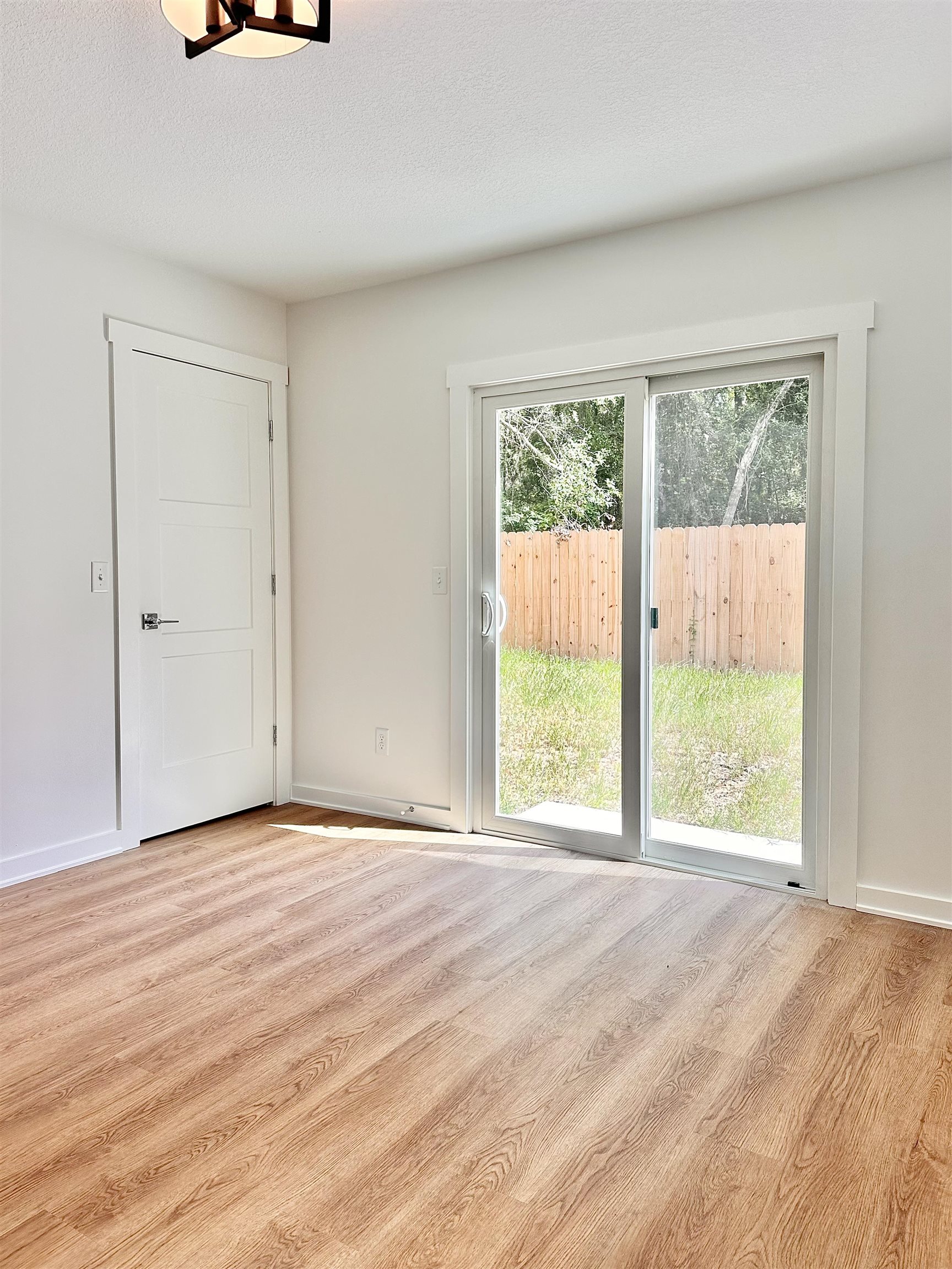 723 West 6th Street St. Augustine, FL 32084 - Photo 9 of 14 a view of an empty room with a window