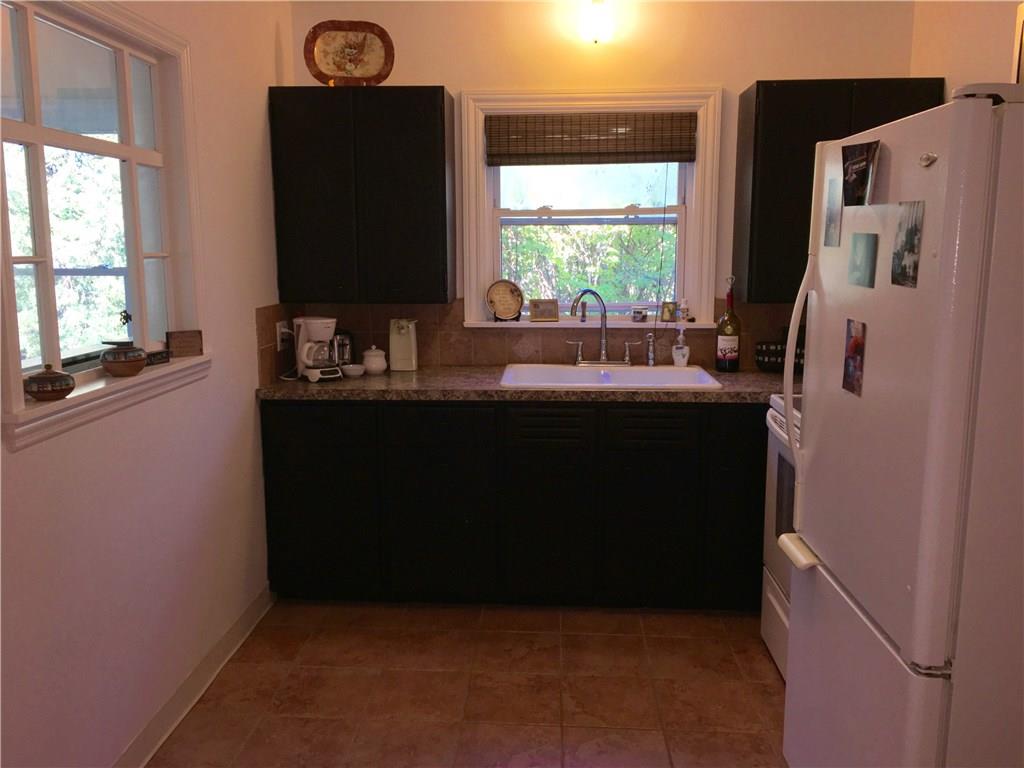 117 Azalea Lane Rector, PA 15677 - Photo 12 of 25 The Kitchen has Ceramic Tile Floors and has been recently updated. The view to the backyard is a plus from the wonderful double bowl sink.