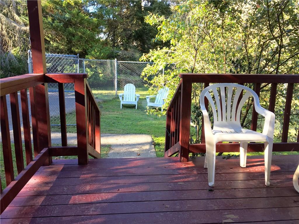 117 Azalea Lane Rector, PA 15677 - Photo 15 of 25 This covered porch/deck is right off of the family Room and the fenced in yard has a agte leading to the driveway.