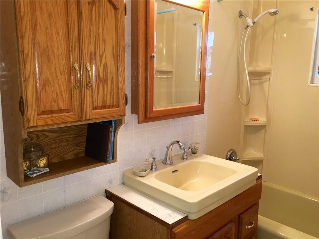 117 Azalea Lane Rector, PA 15677 - Photo 20 of 25 The bathroom has a cast iron tub/shower combo, Kohler toilet and solid enamel sink bowl. The oak cabinets offer good storage too! There is a vent window high in the shower area as well as an electric ventilation fan in the ceiling.