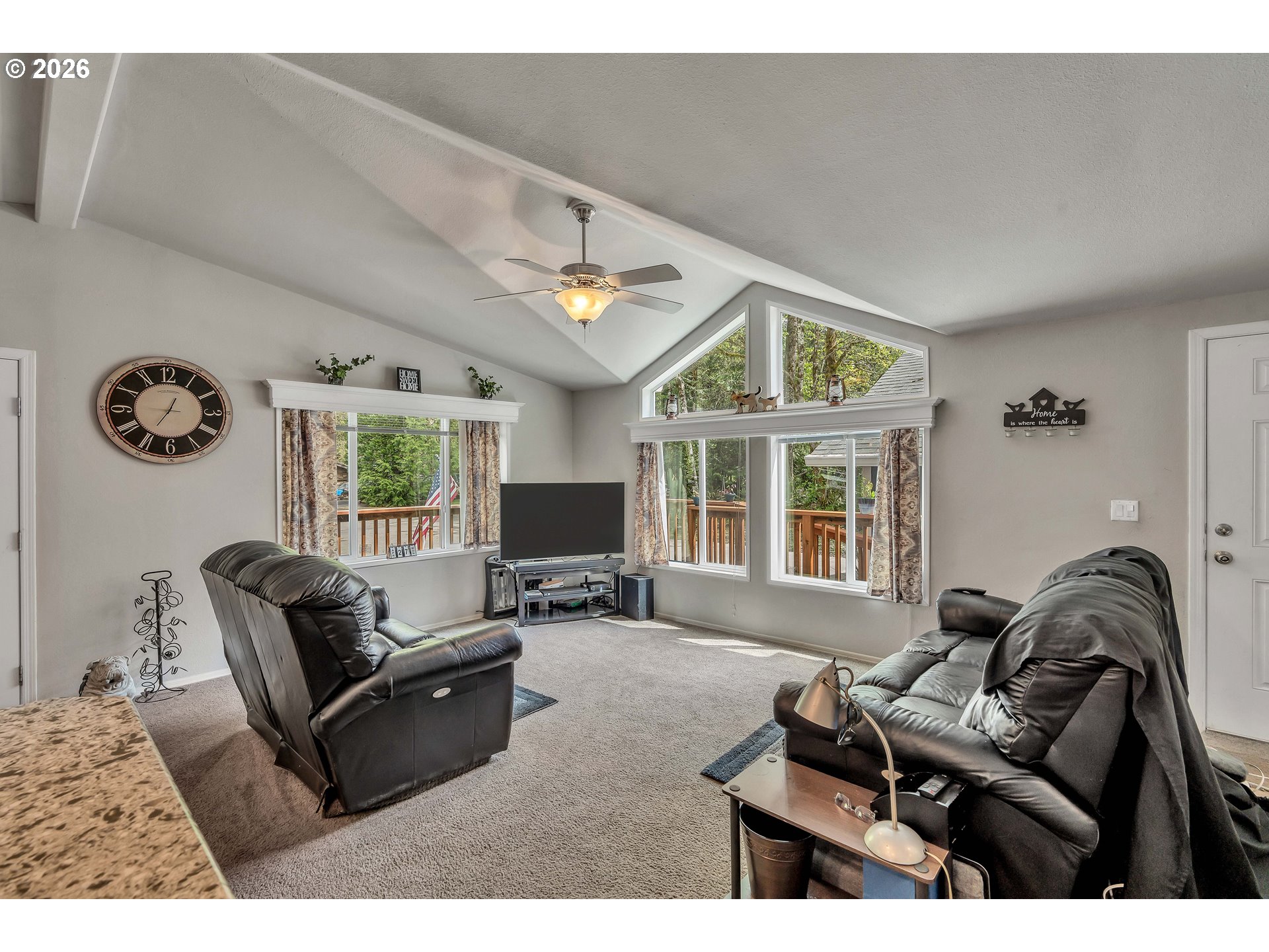 21494 Hideway Lane Rhododendron, OR 97049 - Photo 7 of 34 a living room with furniture a window and a clock
